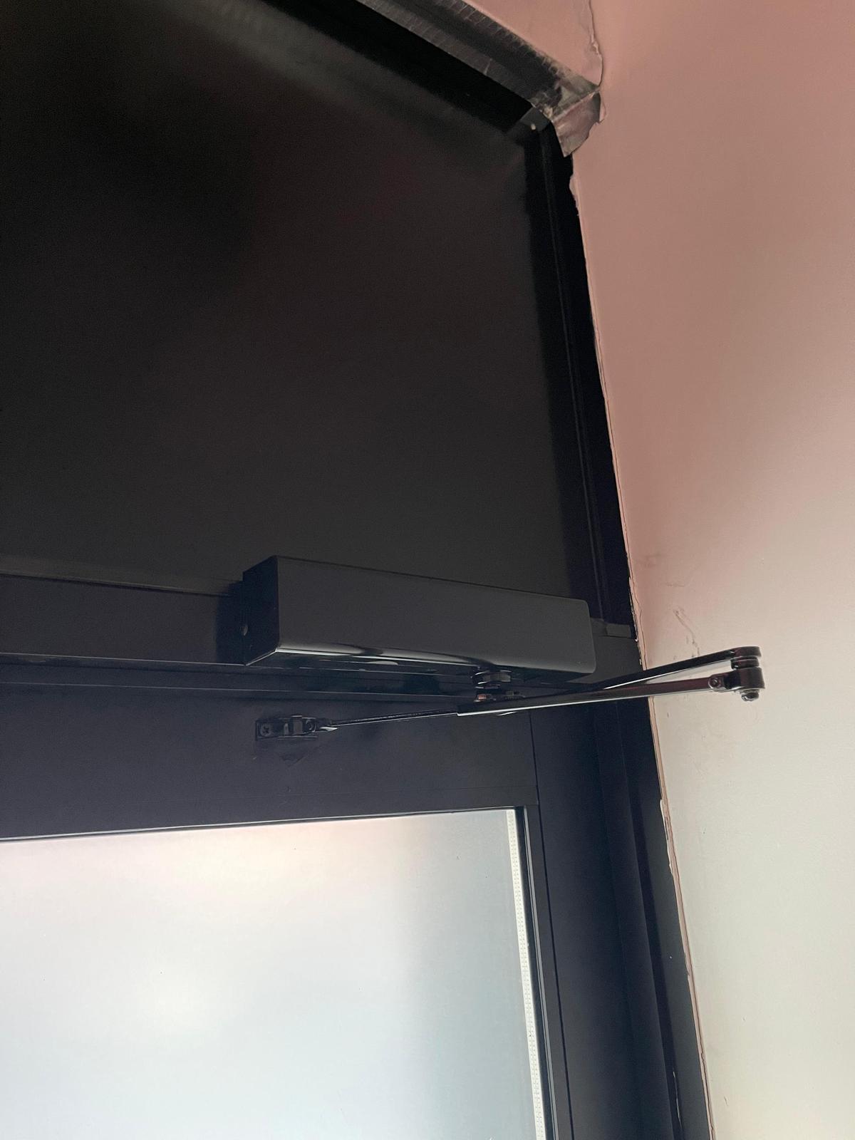 Black door closer installation NYC